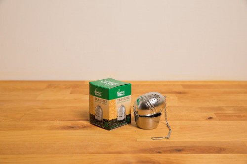 Stainless steel tea infuser - tea egg with tray from the Steenbergs UK online speciality loose leaf tea shop.