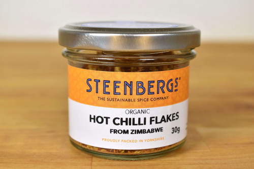 Steenbergs Organic Hot Chilli Flakes 30g in Glass Jar (reusable or recyclable) from the Steenbergs UK online shop for organic herbs and spices.