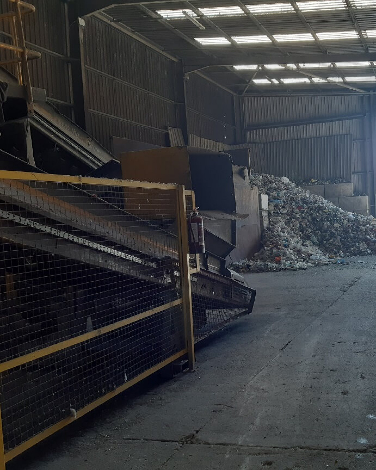 Raw Mixed Recycling Ready To Go Through Mechanical Sorting (On Left)