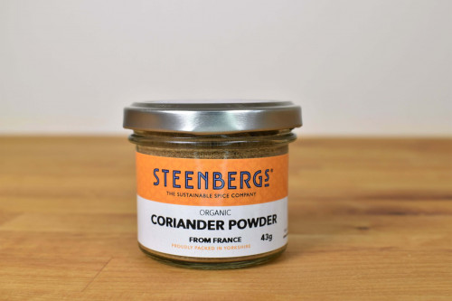 Steenbergs Organic Coriander Powder in glass jar part of the UK Steenbergs range of organic herbs and spices.
