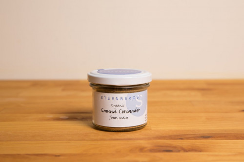 Steenbergs Organic Coriander Powder in glass jar part of the UK Steenbergs range of organic herbs and spices.