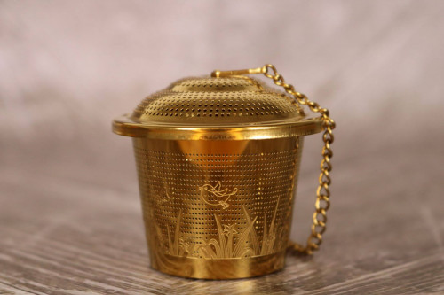 Gold Coloured Basket Tea Infuser with tray from the Steenbergs UK online shop for loose leaf tea and tea infusers.