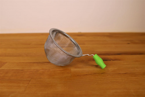 Stainless Steel Tea Infuser  or Strainer with Green Silicone Handle from the  Steenbergs UK online shop for loose leaf teas, herbal infusions and tea infusers.